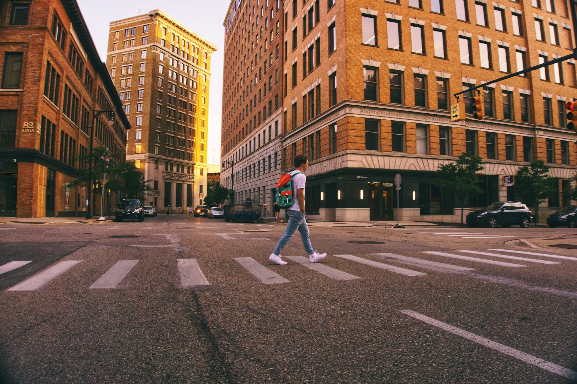 Man walking on pedestrian lane Grand Rapids MI