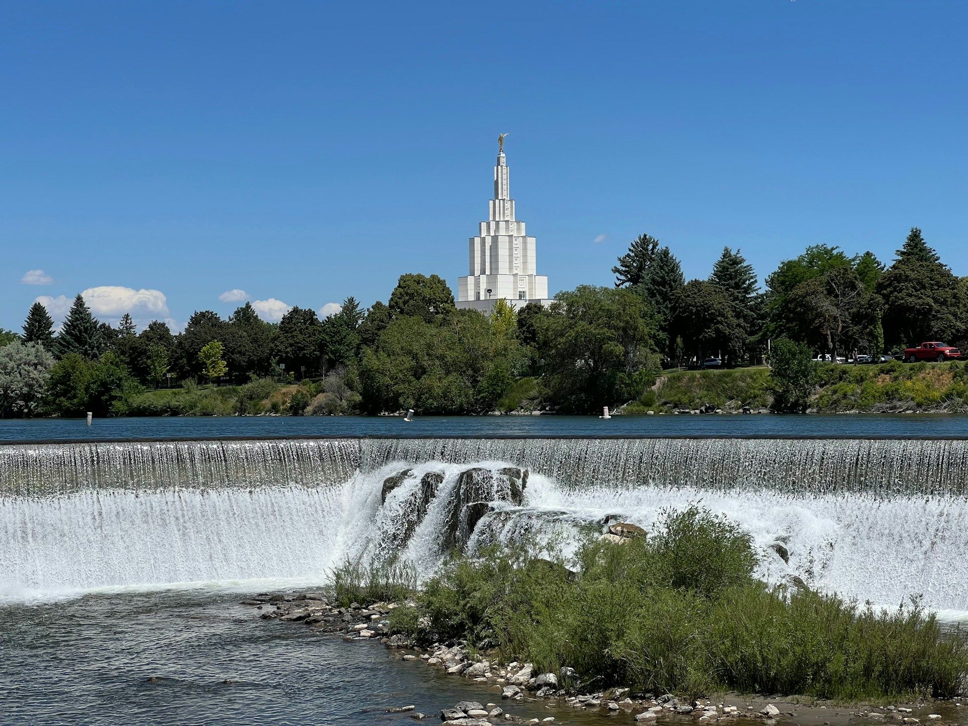 Large waterfall with church Idaho Falls