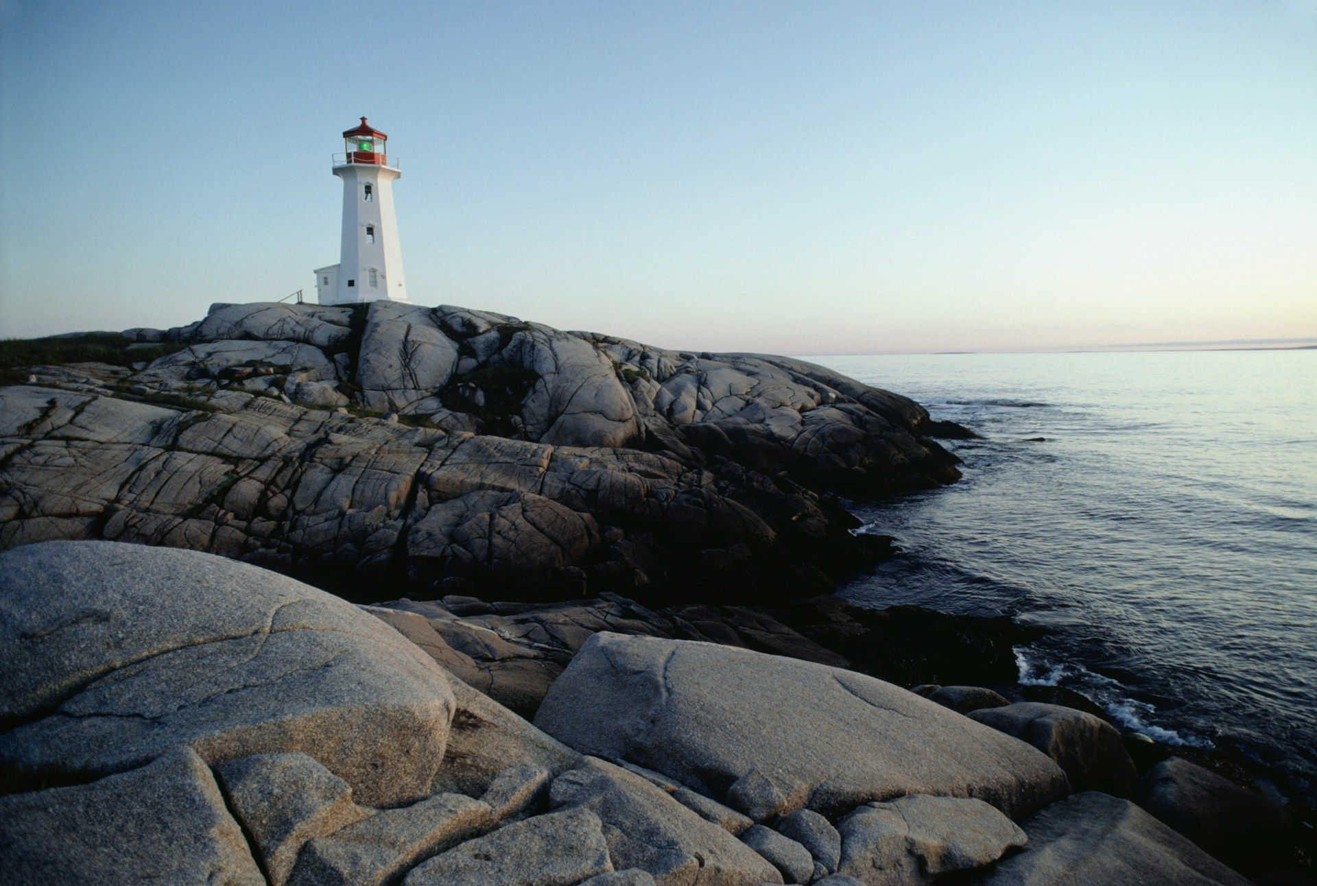 Lighthouse on rocky shore in Maine