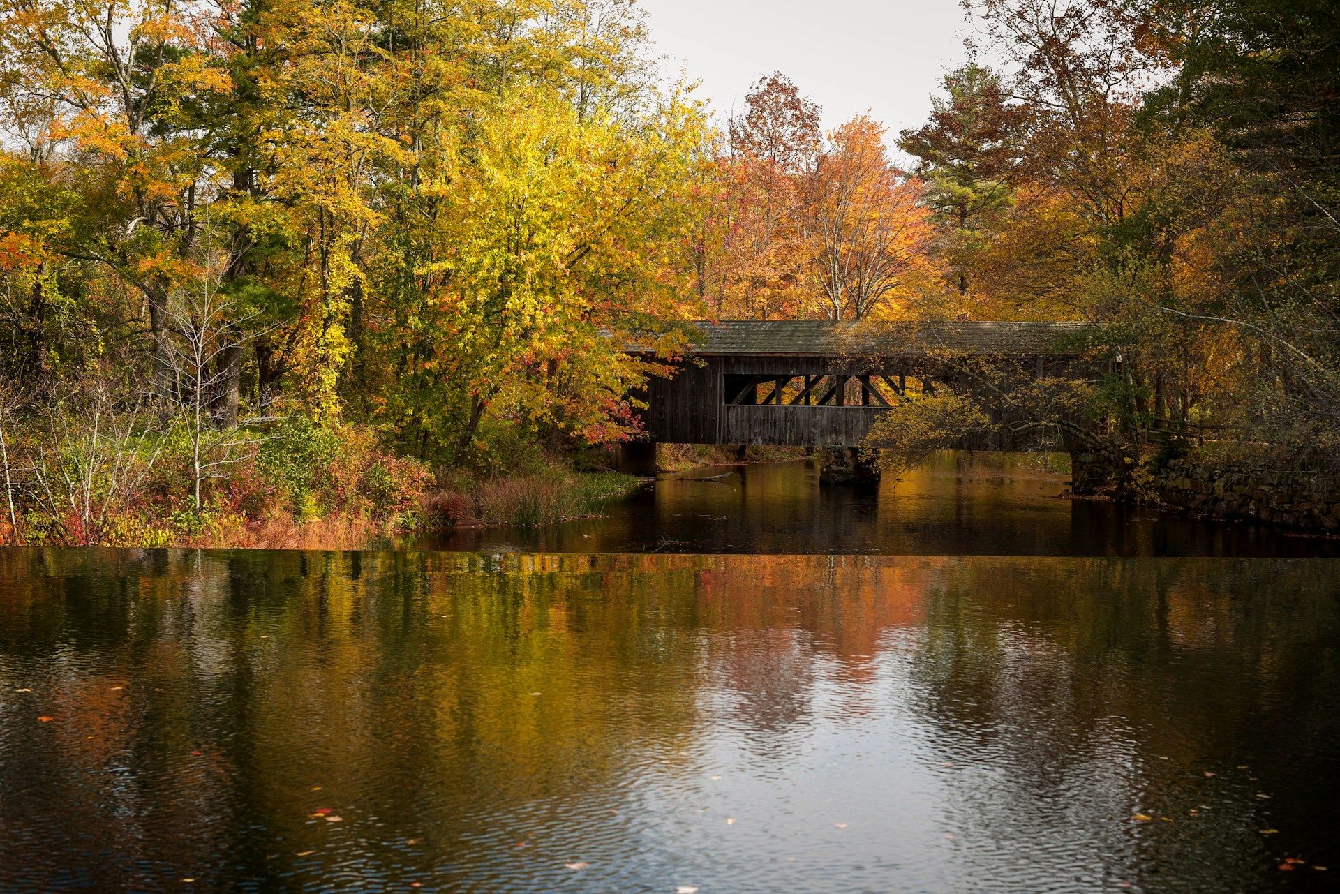 Brown wooden house on lake Massachusetts