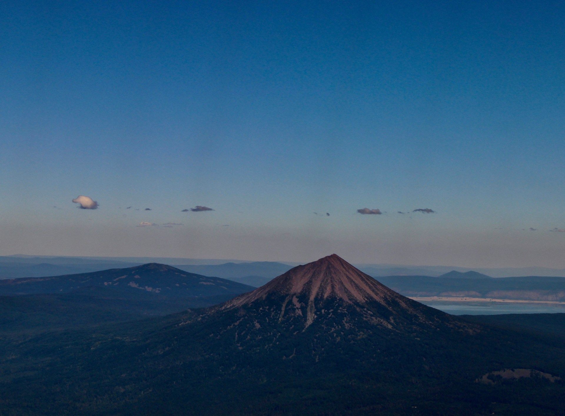 Birds flying over Medford mountain