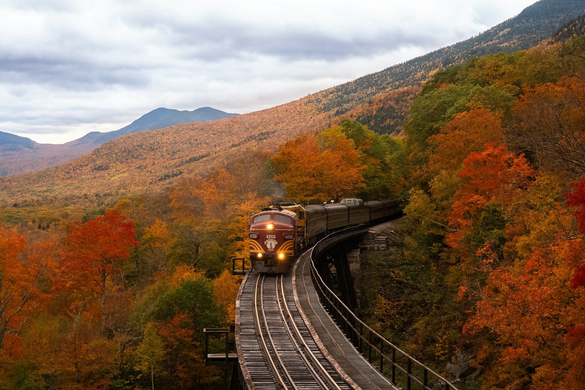 Orange train in New Hampshire autumn