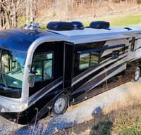 Ozzy's Castle on Wheels Fleetwood Revolution Class A