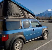 The ECamper: A Mini-Glamping Blue Boxcar for Alaskan Adventure.