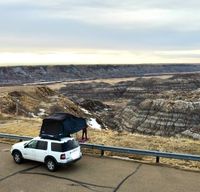 Ford Explorer with Thule rooftop tent (annual Parks Canada Pass included)
