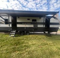 Clean camper with unique layout, outdoor kitchen, and Verlo mattress
