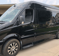 Mercedes 8 Passenger Travel Van with TV's and Galley.