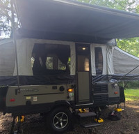 The Adkins Family Rugged Family Camper where the AC is nice and cold.