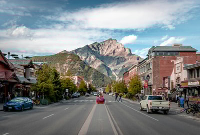 Man in red jacket riding motorcycle Banff