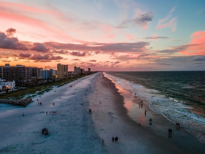 People on Jacksonville beach at sunset