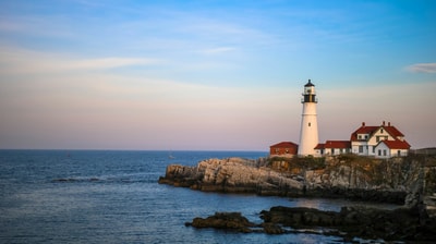 Rocky cliff by water in Maine