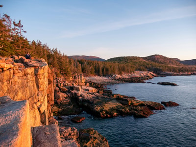 Rocky cliff by water in Maine