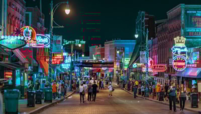 People walking in Memphis TN at night