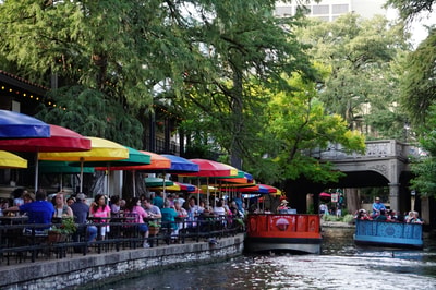 People on red boat San Antonio TX