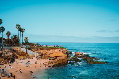 Person holding surfboard in San Diego