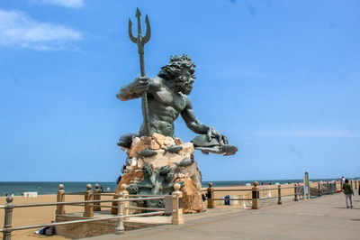 Statue of man holding fish Virginia Beach